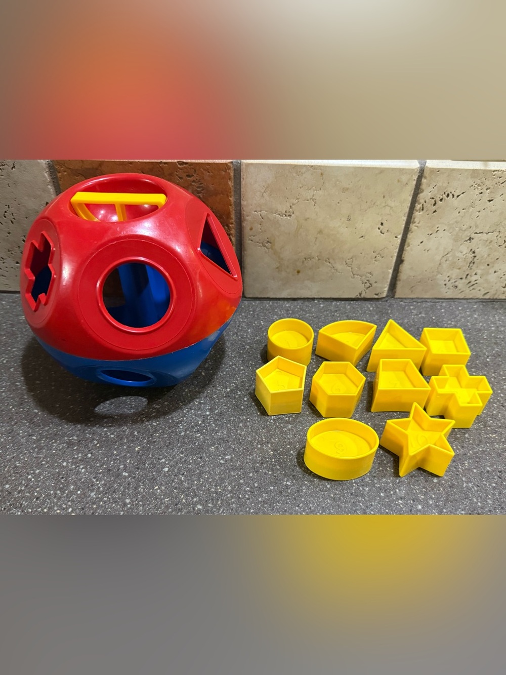 Tupperware Toddler Shape Sorting Ball Toy - Red & Blue with Yellow Shapes